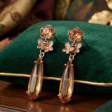 Gold Metal Tassel Earrings with Grey Stone | Long Party Wear Earrings for Women & Girls